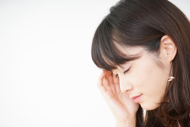 首肩痛の女性